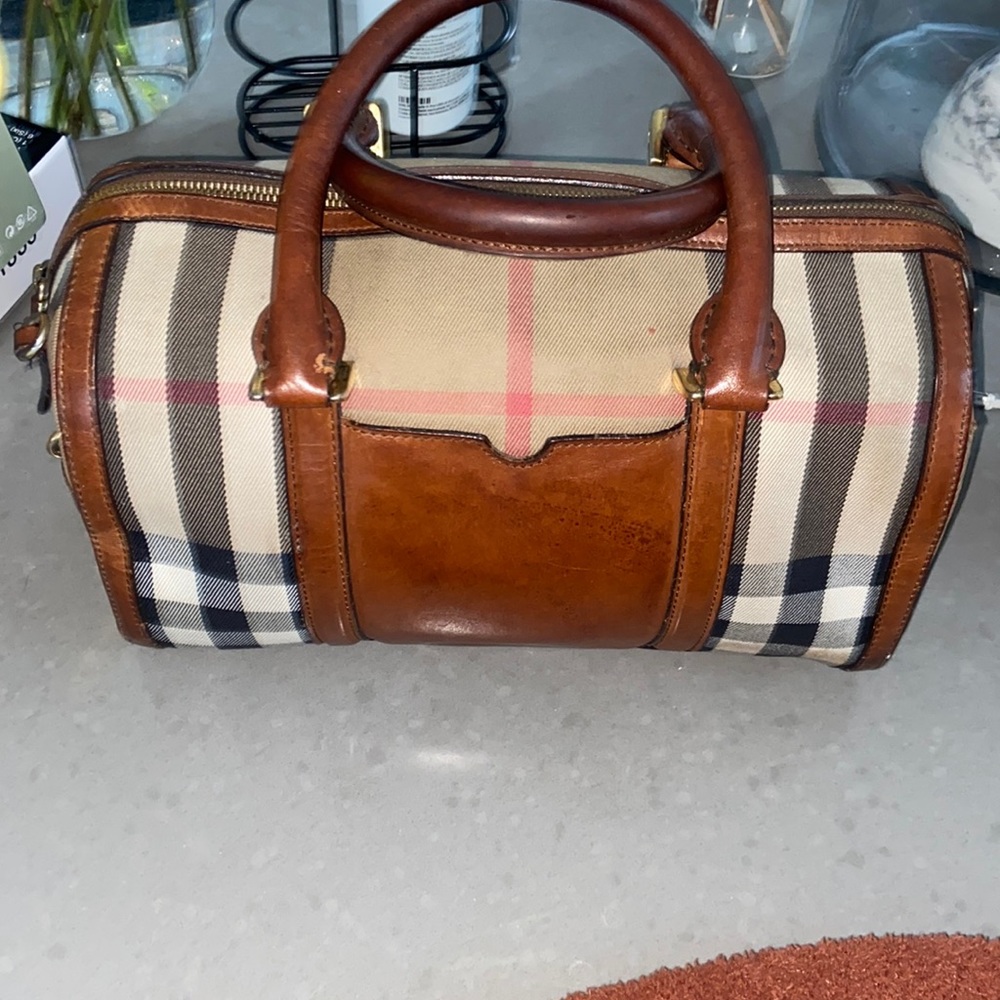 Burberry Bowling Bag used missing pieces from bag needs cleaning